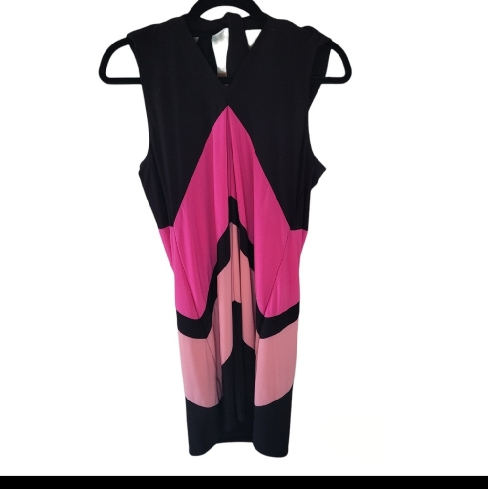 Tiana B.peach, pink, and black dress. Ties up in the back. Black button …